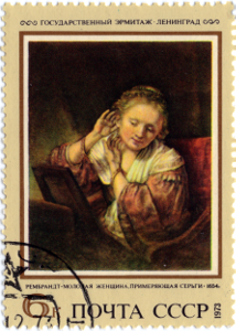 Рембрандт "Молодая женщина, примеряющая серьги"